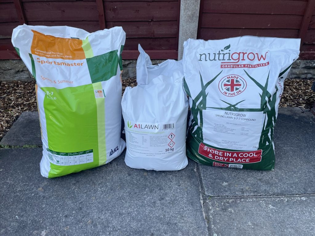 Three different lawn fertiliser bags with their product labels visible